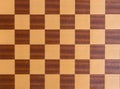 Squares of a wooden chessboard background