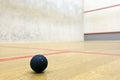 Squash ball in sport court