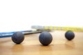 Squash balls scattered on the squash court at the tournament professional player Royalty Free Stock Photo