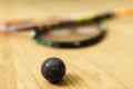 Squash game concept, racket and ball closeup view Royalty Free Stock Photo