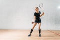 Squash game training, female player with racket