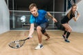 Squash game training, players with rackets