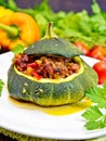 Squash green stuffed with meat and vegetables on board