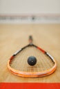 Squash rackets and ball on court floor closeup Royalty Free Stock Photo