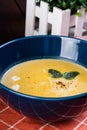 Squash soup with cream and roasted Parmesan cheese
