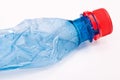 Squashed plastic blue bottle Royalty Free Stock Photo