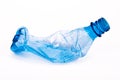 Squashed plastic blue bottle