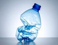 Squashed Plastic Bottle Clean Background for Eco Campaigns generative ai Royalty Free Stock Photo