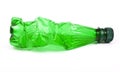 Squashed plastic green bottle