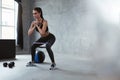 Squats. Sports Woman In Fashion Clothes Squatting With Band Royalty Free Stock Photo