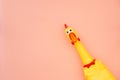 Squawking chicken or squeaky toy are shouting and copy space pastel pink background. Chicken shouting Toy on pink background