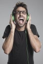 Squealing boy with headphones Royalty Free Stock Photo