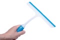 A squeegee or squilgee, tool with a flat, smooth rubber blade, used to remove or control the flow of liquid on a flat surface on w