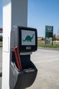 Gardiner, Montana - August 23, 2021: Squeegee windshield wiper fluid container to clean car windows at a Sinclair gas station