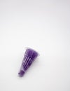 Squeezable purple jelly in plastic cone package isolated on whit