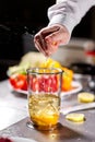 Squeeze the juice of a lemon. Beating of homemade mayonnaise with olive oil. Mix ingredients for sauce. The chef uses a Royalty Free Stock Photo