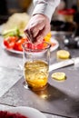 Squeeze the juice of a lemon. Beating of homemade mayonnaise with olive oil. Mix ingredients for sauce. The chef uses a Royalty Free Stock Photo