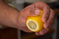 Squeeze lemon juice on hand Royalty Free Stock Photo