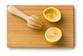 Squeezed lemon fruit and citrus reamer Royalty Free Stock Photo