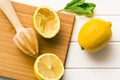 Squeezed lemon fruit and citrus reamer Royalty Free Stock Photo