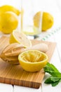 Squeezed lemon fruit and citrus reamer Royalty Free Stock Photo