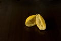 Squeezed lemon skins on dark background - lemon peel Royalty Free Stock Photo