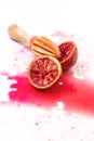 Squeezed Sliced Ripe Juicy Sicilian Blood Oranges on White Background Tasty Oranges Wooden Squeezer Vertical Top View