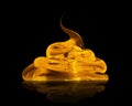 Squeezed transparent yellow gel with bubbles on black background Royalty Free Stock Photo
