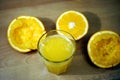 Squeezing an orange with a manual press. Royalty Free Stock Photo