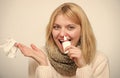 Squeezing the pump. Unhealthy girl with runny nose using nasal spray. Cute woman nursing nasal cold or allergy. Sick