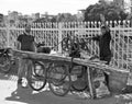 Squeezing sugar cane. Men extract the juice from sugar cane in an alley in Udaipur. Royalty Free Stock Photo