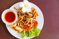 Squid fired in plate with tomato sauce