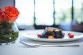 Squid ink spaghetti dish with basil with flowers Royalty Free Stock Photo