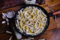 Squid pasta composition on a wooden background