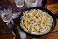 Squid pasta composition on a wooden background