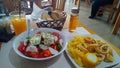 Squid with potatoes and greek salad Royalty Free Stock Photo