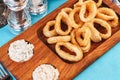 Squid rings fried in batter snack for beer with cream sauce and steamed rice Royalty Free Stock Photo