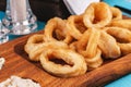 Squid rings fried in batter snack for beer with cream sauce and steamed rice Royalty Free Stock Photo