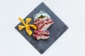 Squid Tentacle Sashimi served with Sliced Radish Royalty Free Stock Photo