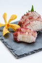 Squid Tentacle Sashimi served with Sliced Radish Royalty Free Stock Photo