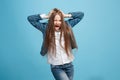 The squint eyed teen girl with weird expression isolated on blue Royalty Free Stock Photo