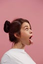 The squint eyed woman with weird expression isolated on pink Royalty Free Stock Photo