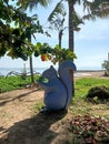 Squirrel statue sitting on the edge of Sanur beach