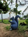 Squirrel statue under a coconut tree on Sanur beach, Denpasar, Bali