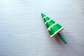 Squish toy in the form of a Christmas tree on a light background, top view, close-up, space for text-the concept of buying useful