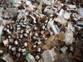 Sremska Mitrovica, Serbia. 07 February 2021, Room with trash in an abandoned house. Packages, paper, plastic items, medicines,