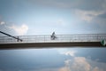 SREMSKA MITROVICA, SERBIA - JUNE 10, 2023: man riding a bicycle in the city center of Sremska Mitrovica, on the Most svetog