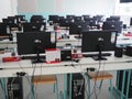 Sremska Mitrovica, Serbia, May 15, 2021 Group of computer neatly placed in a computer lab. Computers, monitors, wires in