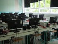 Sremska Mitrovica, Serbia, May 15, 2021 Group of computer neatly placed in a computer lab. Computers, monitors, wires in