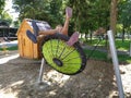 Sremska Mitrovica, Serbia, 13 September 2020. Children swing on a spider-web swing. Boy and girl, brother and sister in the summer Royalty Free Stock Photo